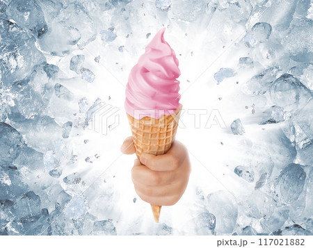 Soft ice cream in hand on background of broken ice 117021882