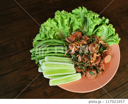 Sausage Salad with Fried Fermented Pork Sausage Local food of the Northeast of Thailand. 117021957