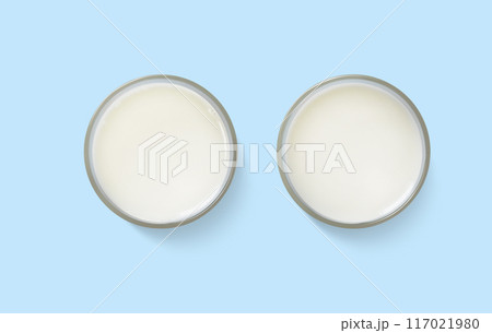 Milk in a glass  top view  on a blue background 117021980