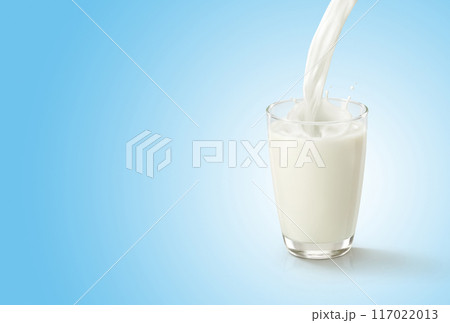 Pour water into glass on blue white background 117022013