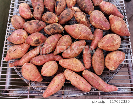 Roasted sweet potatoes on a hot stove 117022329