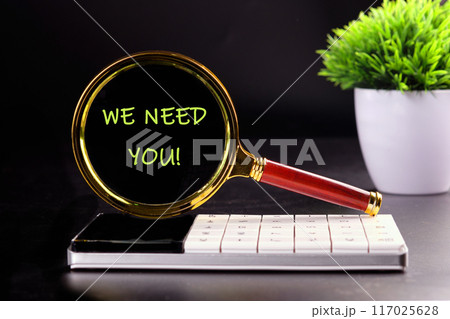 Text WE NEED YOU through the lens of a magnifying glass in the dark Text WE NEED YOU through the lens of a magnifying glass in the dark 117025628
