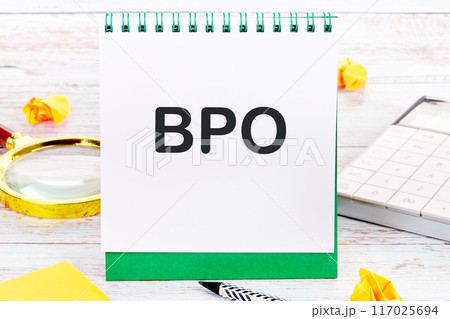 Business concept. Letters BPO. Business Process Outsourcing on a blank sheet in a notebook Business concept. Letters BPO. Business Process Outsourcing on a blank sheet in a notebook 117025694