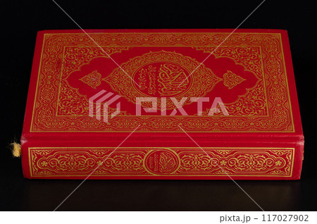 Closed red koran book Closed red koran book 117027902