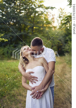 a 30-year-old couple in love in the garden a 30-year-old couple in love in the garden 117030061