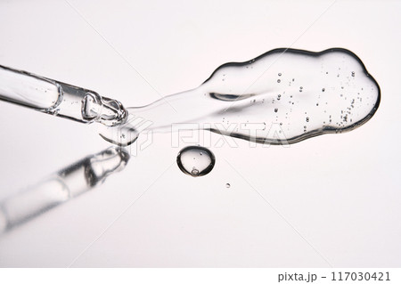 Pipette with cosmetic gel or serum close-up. 117030421