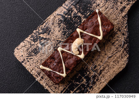 Delicious sweet brownies with chocolate and nuts 117030949