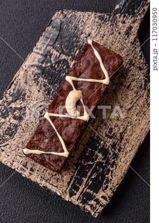 Delicious sweet brownies with chocolate and nuts 117030950