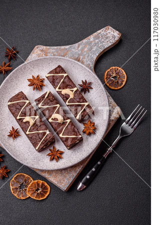 Delicious sweet brownies with chocolate and nuts 117030980