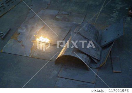 Laser cleaning of metal. The laser beam cleans the metal surface from rust. Laser removes removing old rust from metal. Innovation metalworking. New technologies 117031978