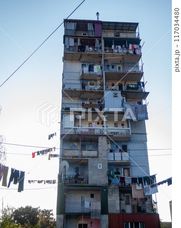 Old courtyards. Streets of Batumi. Old Soviet architecture. Clothes hanging on ropes. Vintage atmosphere of courtyards. Tuhiu streets. Old courtyards. Streets of Batumi. Old Soviet architecture. Clothes hanging on ropes. Vintage atmosphere of courtyards. Tuhiu streets. 117034480