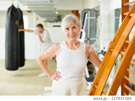 Positive mature woman in gym Positive mature woman in gym 117037164