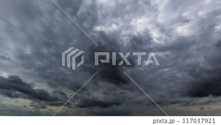 Bad or moody weather sky and environment. carbon dioxide emissions, greenhouse effect, global warming, climate change. The dark sky with heavy clouds converging and a violent storm before the rain. Bad or moody weather sky and environment. carbon dioxide emissions, greenhouse effect, global warming, climate change. The dark sky with heavy clouds converging and a violent storm before the rain. 117037921