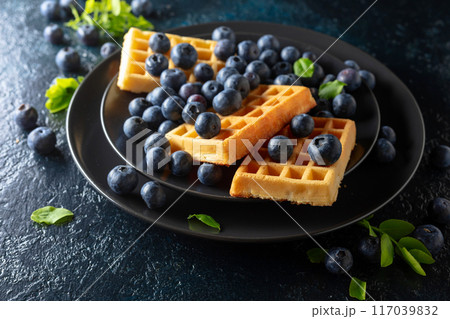 Belgian waffles with blueberries. Belgian waffles with blueberries. 117039832