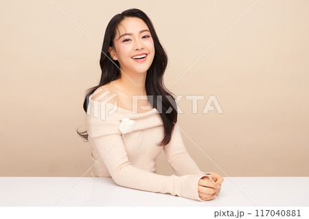 Beautiful young asian woman with clean fresh skin on beige background, Face care, Facial treatment, Cosmetology, beauty and spa, Asian women portrait. Beautiful young asian woman with clean fresh skin on beige background, Face care, Facial treatment, Cosmetology, beauty and spa, Asian women portrait. 117040881
