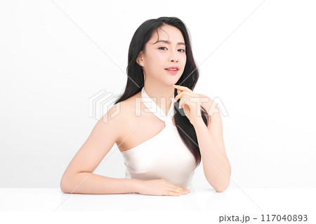 Beautiful young asian woman with clean fresh skin on white background, Face care, Facial treatment, Cosmetology, beauty and spa, Asian women portrait. Beautiful young asian woman with clean fresh skin on white background, Face care, Facial treatment, Cosmetology, beauty and spa, Asian women portrait. 117040893