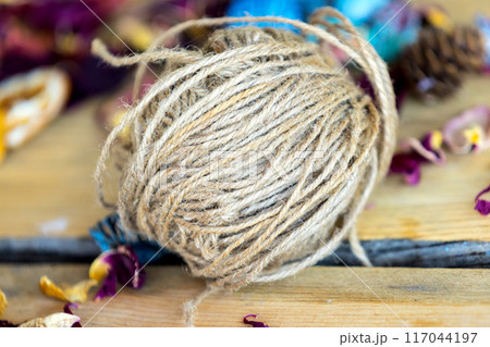 Close-up roll of brown jute twine for crafting 117044197