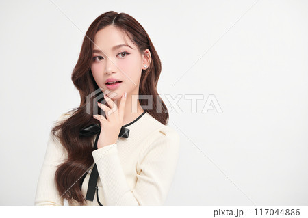 Beautiful young asian woman with clean fresh skin on white background, Face care, Facial treatment, Cosmetology, beauty and spa, Asian women portrait. Beautiful young asian woman with clean fresh skin on white background, Face care, Facial treatment, Cosmetology, beauty and spa, Asian women portrait. 117044886