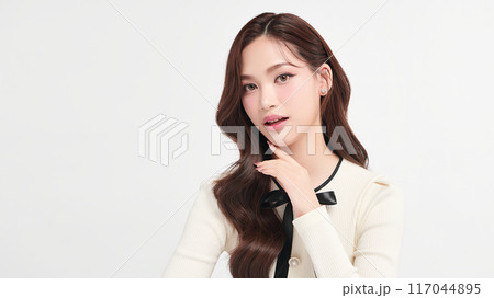 Beautiful young asian woman with clean fresh skin on white background, Face care, Facial treatment, Cosmetology, beauty and spa, Asian women portrait. Beautiful young asian woman with clean fresh skin on white background, Face care, Facial treatment, Cosmetology, beauty and spa, Asian women portrait. 117044895