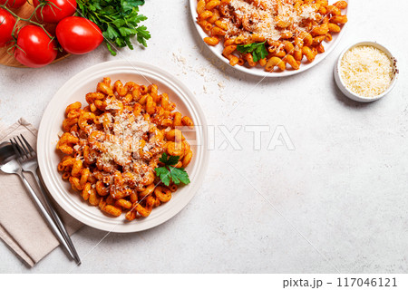 Cavatappi pasta with tomato sauce and grated parmesan cheese 117046121