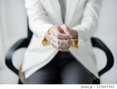 Woman hand with wrist pain numbness and pain in the palm of the hand has pain and tingling in the nerve endings This is a side effect of sitting and working for a long time on a laptop at the office Woman hand with wrist pain numbness and pain in the palm of the hand has pain and tingling in the nerve endings This is a side effect of sitting and working for a long time on a laptop at the office 117047703