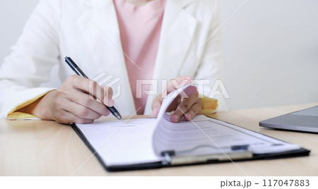 Business woman employer holding resume hiring recruit looking cv resume to hire candidates, analyzing information before job interview. Recruitment concepts 117047883