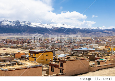 Elevated cityscape view of Litang old town in Ganzi Tibetan autonomous region, with scenic mountains in the background Elevated cityscape view of Litang old town in Ganzi Tibetan autonomous region, with scenic mountains in the background 117048641