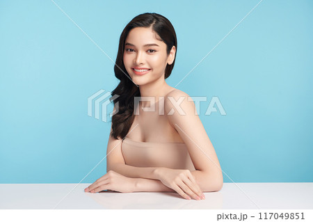 Beautiful Young transgender woman with clean fresh skin on blue background, Face care, Facial treatment, Cosmetology, beauty and spa, transgender women portrait. 117049851