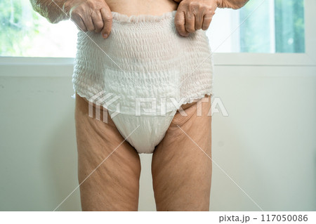 Asian senior woman patient wearing incontinence diaper in hospital, healthy strong medical. Asian senior woman patient wearing incontinence diaper in hospital, healthy strong medical. 117050086
