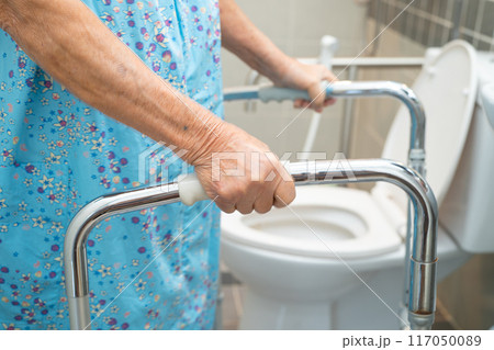 Asian elderly woman patient use walker and toilet bathroom handle security in nursing hospital, healthy strong medical. Asian elderly woman patient use walker and toilet bathroom handle security in nursing hospital, healthy strong medical. 117050089