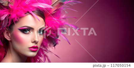 The face of a girl with pink makeup and pink feather jewelry in her hair The face of a girl with pink makeup and pink feather jewelry in her hair 117050154