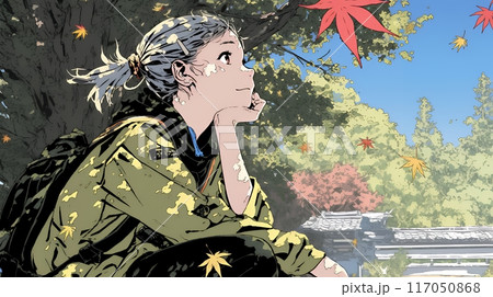 秋の紅葉を見ている若い女性