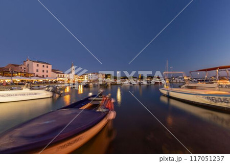 Picture over the harbor of Fazana in Istria in the evening during sunset 117051237