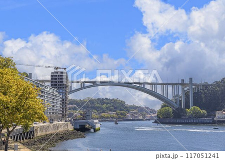 a beautiful bridge with a view to the water and trees a beautiful bridge with a view to the water and trees 117051241