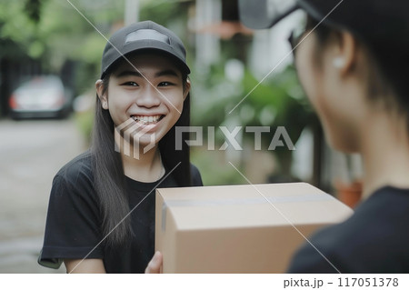 Excited Asian Girl Welcoming Delivery of Parcel Boxes 117051378
