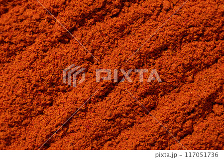 Ground paprika, red terracotta spice background, art in cooking. Ground paprika, red terracotta spice background, art in cooking. 117051736