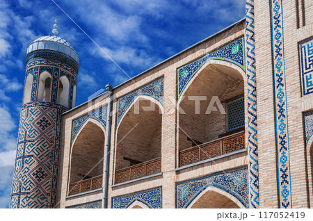 Brick walls decorated with ceramic tiles with oriental asian pattern of Kukeldash madrasah in Uzbekistan in Tashkent. Ancient old Islamic madrasa in Asia Brick walls decorated with ceramic tiles with oriental asian pattern of Kukeldash madrasah in Uzbekistan in Tashkent. Ancient old Islamic madrasa in Asia 117052419
