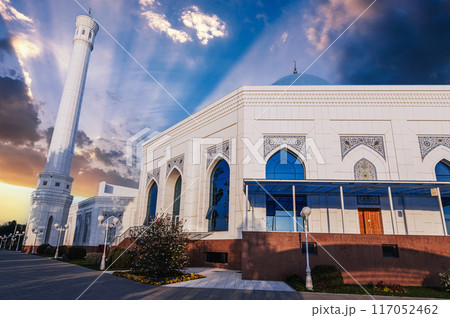 white minaret of new Masjid Minor Mosque in Tashkent in Uzbekistan in summer at sunset 117052462