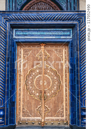 Wooden door with carved pattern Uzbek ornament in Museum of Victims of Political Repression in Tashkent in Uzbekistan 117052490