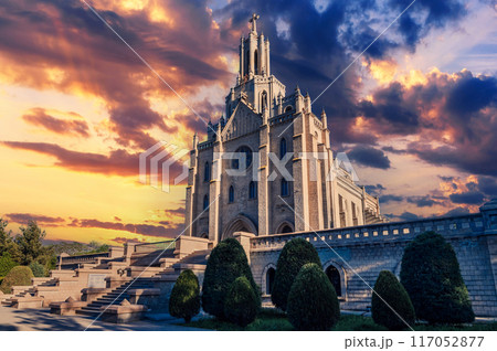 Cathedral of the Sacred Heart of Jesus in Tashkent in Uzbekistan. Exterior view of ancient Roman Catholic Church on background of cloudy beautiful sky in summer Cathedral of the Sacred Heart of Jesus in Tashkent in Uzbekistan. Exterior view of ancient Roman Catholic Church on background of cloudy beautiful sky in summer 117052877