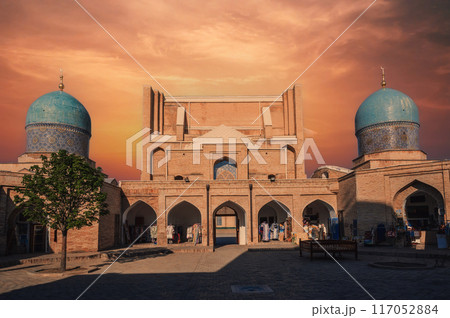 ancient Islamic madrasah Barakhan in Tashkent in Uzbekistan. Architectural complex Hazrati Imam in summer at sunset 117052884