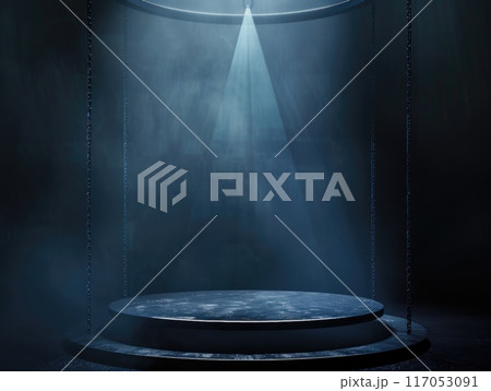A dark room with a spotlight shining on a stage A dark room with a spotlight shining on a stage 117053091