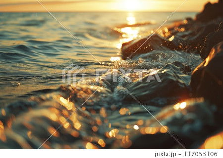 The water is calm and the sun is setting 117053106