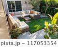 A patio with a couch and a table 117053354
