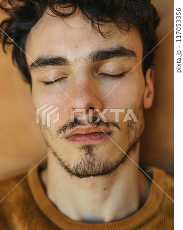 A man with a beard and mustache is sleeping 117053356