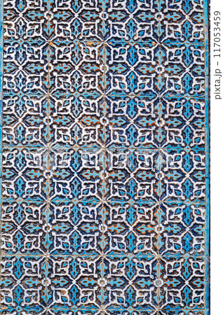 wall of ancient Muslim mosque Hazrati Imam is decorated with ceramic tiles with vintage Uzbek ornament Islamic pattern in Uzbekistan wall of ancient Muslim mosque Hazrati Imam is decorated with ceramic tiles with vintage Uzbek ornament Islamic pattern in Uzbekistan 117053459