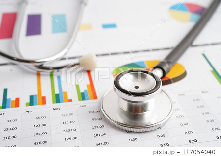 Stethoscope and US dollar banknotes on chart or graph paper, Financial, account, statistics and business data medical health concept. Stethoscope and US dollar banknotes on chart or graph paper, Financial, account, statistics and business data medical health concept. 117054040