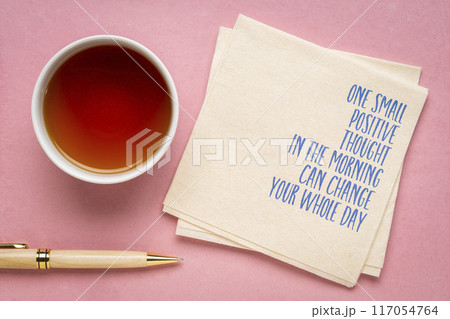One small positive thought in the morning can change your whole day - inspirational handwriting on a napkin, positivity concept One small positive thought in the morning can change your whole day - inspirational handwriting on a napkin, positivity concept 117054764