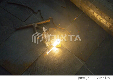 Laser cleaning of metal. The laser beam cleans the metal surface from rust. Laser removes removing old rust from metal. Innovation metalworking. New technologies 117055189