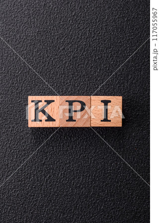 Inscription KPI Key Performance Indicator with wooden cubes 117055967